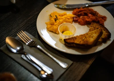 A second breakfast plate of scrambled eggs, smoked salmon and toast.