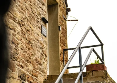Stone steps and railing leading up to the entrance of Thorshaven Apartment
